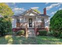 Charming one-story home with a front porch and well-maintained lawn at 807 Klondale Ave, Kannapolis, NC 28081
