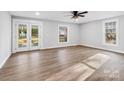 Bright and spacious living room with hardwood floors and french doors at 709 Bringle Ferry Rd, Salisbury, NC 28144