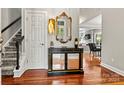 Elegant entryway with hardwood floors and staircase at 18935 Cloverstone Cir, Cornelius, NC 28031