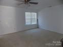 Spacious bedroom with carpeted floor and window coverings at 141 Rock Ridge Ln, Mount Holly, NC 28120