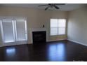 Living room featuring a fireplace and dark hardwood floors at 141 Rock Ridge Ln, Mount Holly, NC 28120