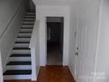 Bright entryway with hardwood floors and staircase leading upstairs at 141 Rock Ridge Ln, Mount Holly, NC 28120