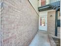 Brick building exterior with a white door at 4605 Coronado Dr # M, Charlotte, NC 28212