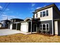 Modern two-story townhouses with gray siding, white garage doors, and neutral colors at 1022 W C St, Kannapolis, NC 28081