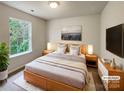Virtually staged main bedroom with a king bed and large windows at 3219 Irwin Valley Ct, Charlotte, NC 28269