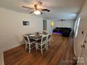 Open concept dining area with a four-seat table and hardwood floors at 2509 Sparrow Springs Rd, Kings Mountain, NC 28086