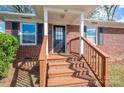 Front porch and stairs of a brick ranch house at 210 N Hoyle St, Cherryville, NC 28021