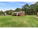 Brick ranch house with a large front yard at 2117 Charlotte Hwy, Mooresville, NC 28117