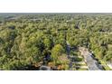 Aerial view of a residential area with mature trees and homes at 201 Smithfield Dr, Charlotte, NC 28270