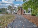 Brick house with sunroom and driveway at 20683-A Us 52 S Hwy, Albemarle, NC 28001