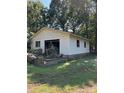 White vinyl-sided garage with a single door and cluttered interior at 538 Rowe Dr, Newton, NC 28658