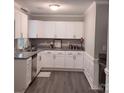 Modern kitchen featuring white cabinets, granite countertops, and stainless steel appliances at 5105 Chelsey Ln, Monroe, NC 28110