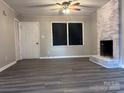 Living room featuring a fireplace, vinyl flooring, and neutral-toned walls at 526 Kings Rd, Shelby, NC 28150