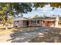 Brick ranch home with covered carport and driveway at 1251 Magnolia St, Albemarle, NC 28001