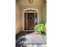 Elegant front door with wreath, flanked by sidelights at 3905 Granite St, Terrell, NC 28682