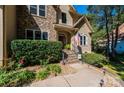 House entrance with stonework, steps, and landscaping at 3905 Granite St, Terrell, NC 28682