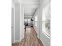 Bright hallway with wood-look floors, leading to living area at 366 Hyssop Ct, Fort Mill, SC 29715