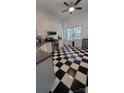 Kitchen with stainless steel appliances and black and white checkered floor at 4000 Wilson Ln, Charlotte, NC 28206