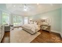 Main bedroom with high ceilings, hardwood floors, and large windows at 105 Coral Bells Ct, Mooresville, NC 28117