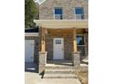 Charming front entrance with brick columns and white door at 1018 Cross Creek Dr, Oakboro, NC 28129