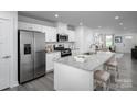Modern kitchen with stainless steel appliances and an island at 107 Jameson Park Dr # 3, Troutman, NC 28166