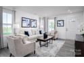 Bright living room with comfy furniture and a neutral color scheme at 107 Jameson Park Dr # 3, Troutman, NC 28166