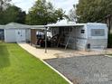 Spacious RV site with covered parking and golf cart at 134 Dove Ln, New London, NC 28127