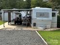 Spacious RV site with covered parking and golf cart at 134 Dove Ln, New London, NC 28127