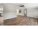 Open concept living room and kitchen with LVP flooring at 1221 Blake Dr, Mount Holly, NC 28120