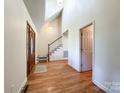 Spacious entryway with hardwood floors and a grand staircase at 3018 Castlebrook Dr, Monroe, NC 28112
