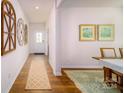 Bright and airy entryway with wood-look floors and stylish wall decor at 3668 Charles Nw St, Conover, NC 28613