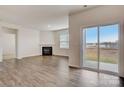 Living room with fireplace and sliding glass door to patio at 3692 Charles Nw St, Conover, NC 28613