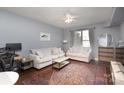 Living Room with light sofa, coffee table, and open kitchen at 1315 East Blvd # 408, Charlotte, NC 28203