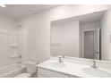 Bathroom with double vanity, tub, and large mirror at 3863 Maxwell Henry Nw Ln, Conover, NC 28613