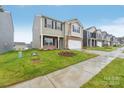 Two-story house with a two-car garage and brick accents at 7906 Old Brook Rd, Sherrills Ford, NC 28673