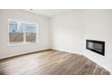 Living room with hardwood floors and a modern electric fireplace at 8059 Plymouth Dr, Sherrills Ford, NC 28673