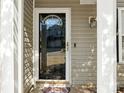 Front door entry with glass panel and a keypad at 1623 Forest Stream Ct, Charlotte, NC 28213