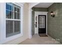 Inviting front entrance with a charming door and well-maintained porch at 45014 Wigeon Ln # 100, Indian Land, SC 29707
