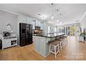 Modern kitchen with large island, stainless steel appliances, and light cabinets at 31226 Cove View Ct, Lancaster, SC 29720