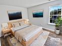 Virtually staged main bedroom with hardwood floors at 114 Laporte Ln, Mooresville, NC 28115