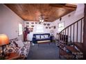 Rustic living room with spiral staircase and wood ceilings at 1111 & 1075 Turkey Creek Ridge Rd, York, SC 29745