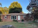 Brick ranch house with a spacious yard and mature trees at 910 N 11Th St, Albemarle, NC 28001