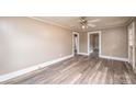 Living room with wood-look floors and ceiling fan at 1528 4Th St Ne Dr, Hickory, NC 28601