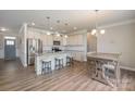 Modern kitchen with stainless steel appliances and an island at 3057 Burnello Ct, Iron Station, NC 28080