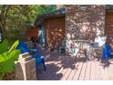 Wooden deck with brick border, table and chairs at 1508 Cecelia Dr, Gastonia, NC 28054