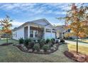 Charming ranch home with well-manicured landscaping at 7403 American Elm Rd, Charlotte, NC 28215
