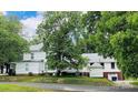 Two-story house with additions, mature trees, and a large yard at 115 S Pearl St, Troy, NC 27371