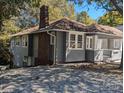 Gray house with a brick chimney and large yard at 602 W Council St, Salisbury, NC 28144