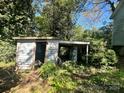 Small, dilapidated shed in need of repair or replacement at 1115 Harrill St, Charlotte, NC 28205