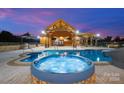 Luxury pool and hot tub with expansive patio and outdoor kitchen at 3460 Jennings Rd, Union Grove, NC 28689